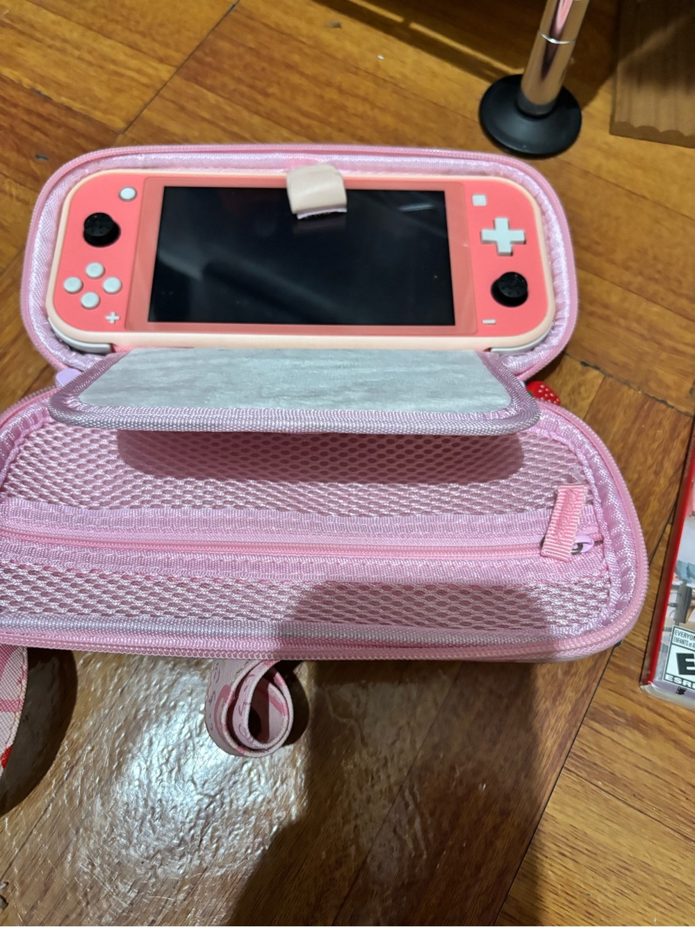 Nintendo Switch Lite with carry case and two games. MISSING CHARGER